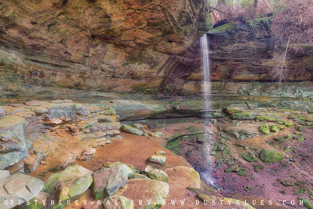 A wide angle view of the Buck Run Falls at Cantwell Cliffs  with the re-entrant cave eroded from behind and numerous slump rock that have fallen over the years.